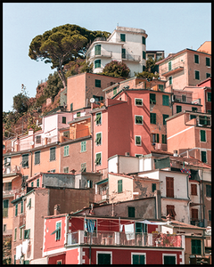 Poster with coastal pink hill-top houses in Riomaggiore. Create an inspiring gallery wall with our posters from the Cinque Terre Collection.